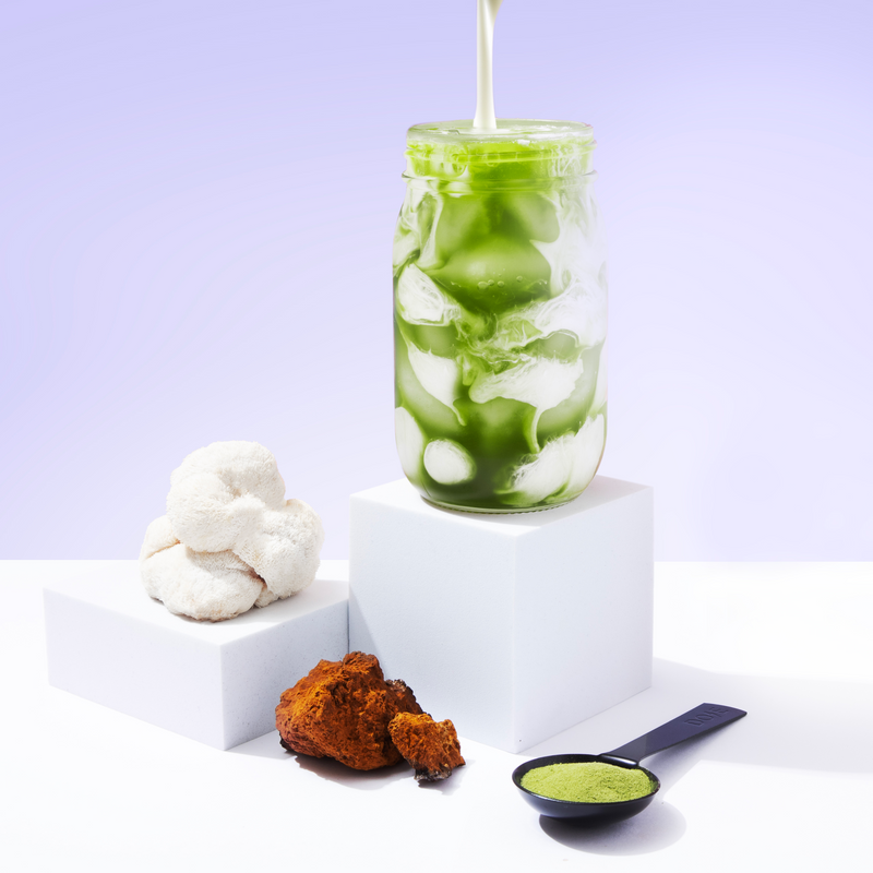 10-Pack of Mushroom Matcha+ showing iced green matcha drink with milk pour and functional mushroom supplements.