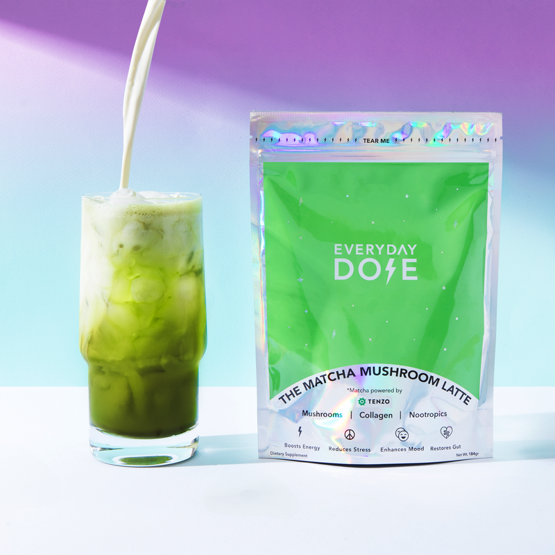 10-Pack of Mushroom Matcha+ packaging with a glass of iced matcha latte and milk being poured on a purple background